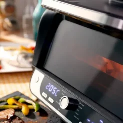 Varmluftsfrituregryde med grill, tilbehør og opskriftsbog InnovaGoods Fryinn 12-in-1 6000 Sort Stål 3400 W 6 L