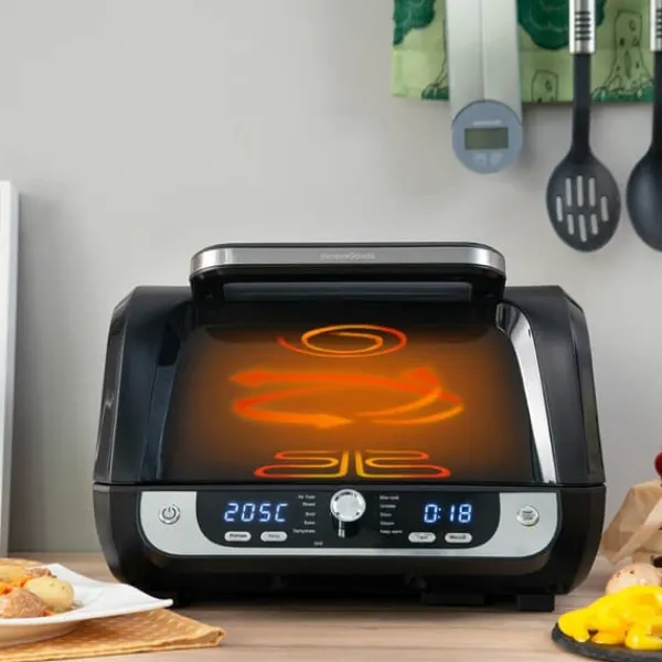 Grill-Ovne & Ovn Med Roterende Stegespyd>Varmluftsfrituregryde med grill, tilbehør og opskriftsbog InnovaGoods Fryinn 12-in-1 6000 Sort Stål 3400 W 6 L