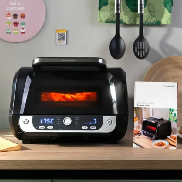 Grill-Ovne & Ovn Med Roterende Stegespyd>Varmluftsfrituregryde med grill, tilbehør og opskriftsbog InnovaGoods Fryinn 12-in-1 6000 Sort Stål 3400 W 6 L
